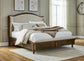 Sturlayne King Upholstered Panel Bed with Mirrored Dresser and Chest