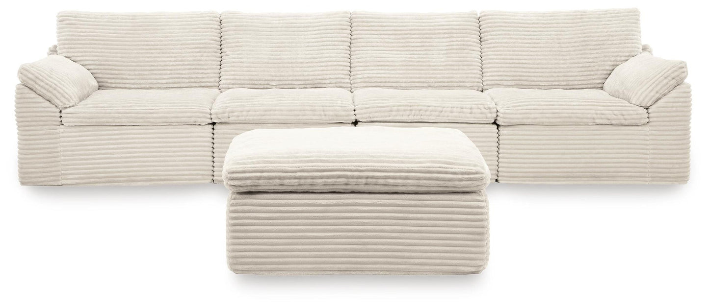 Ashley Express - Canefield 4-Piece Sectional with Ottoman