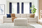 Ashley Express - Canefield 4-Piece Sectional with Ottoman