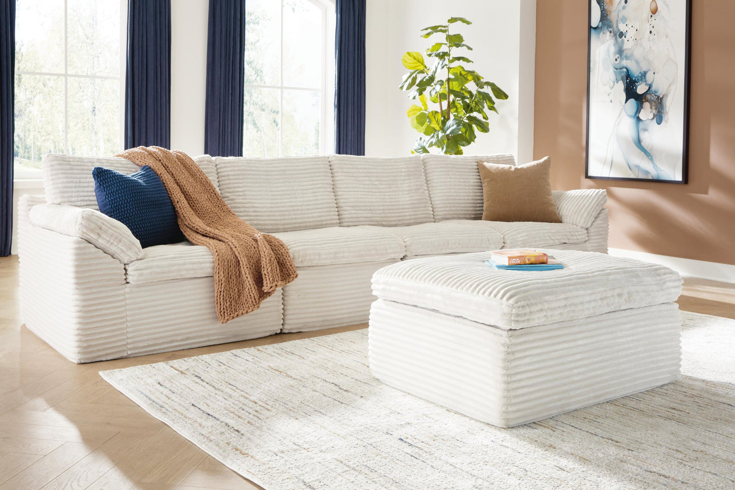 Ashley Express - Canefield 4-Piece Sectional with Ottoman