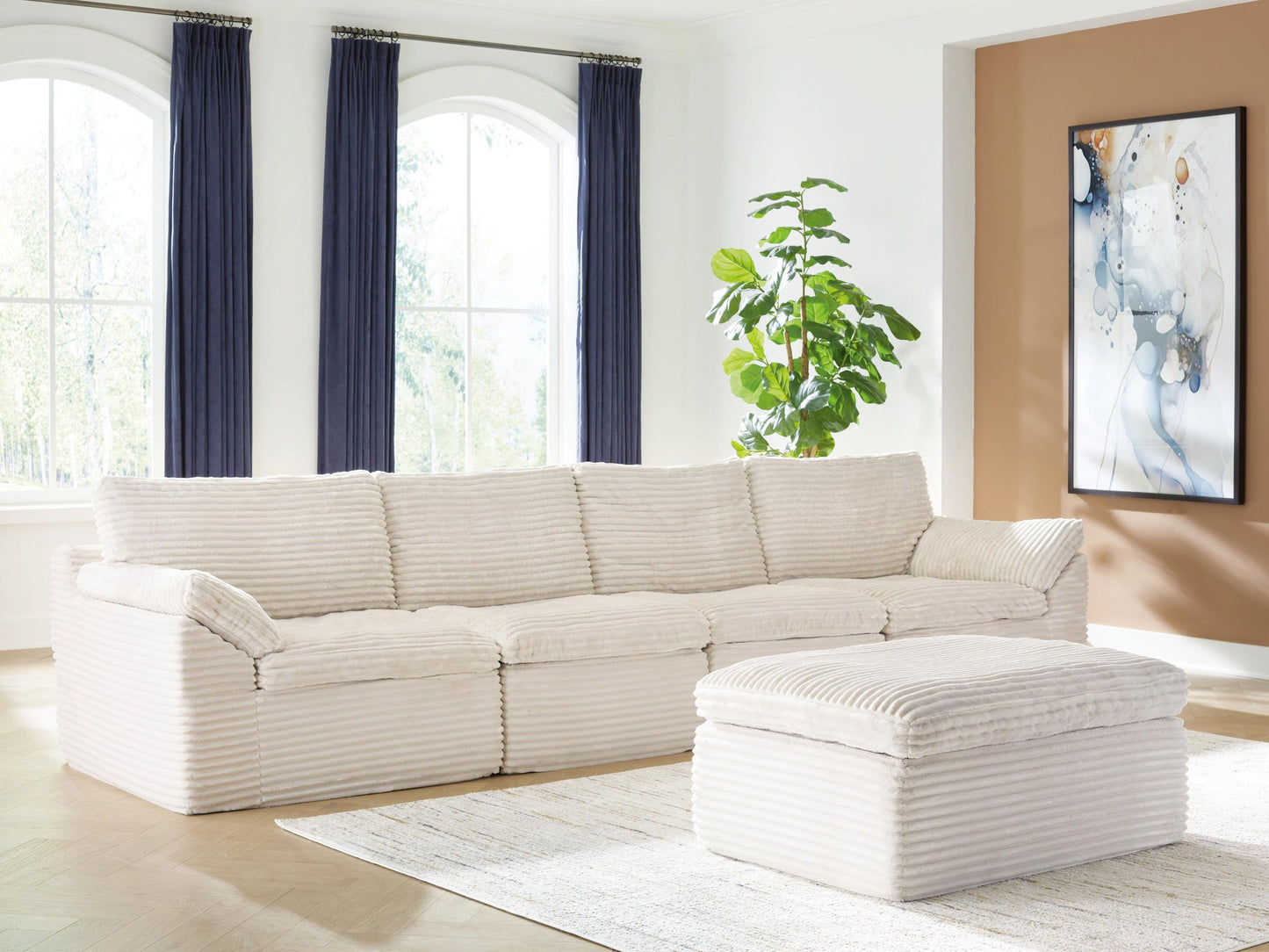 Ashley Express - Canefield 4-Piece Sectional with Ottoman